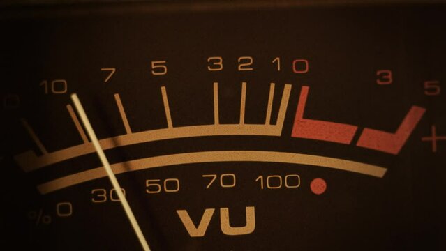 VU meter. Macro shot of a studio volume meter. Symbol of music production, recording and live show broadcasting. A pro equipment video loop, with natural colors. Ideal also for intros or logos