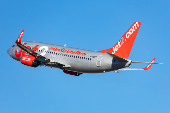 Salzburg, Austria - January 27, 2024: Low Cost airline Jet2 in the air. Boeing 737-700 departing into blue sky.