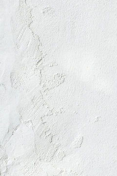 Vertical Blank concrete white rough wall for background. Beautiful white wall surface background pattern..
