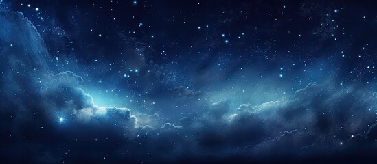 The night sky is a majestic sight, painted in dark blue hues with twinkling stars scattered among fluffy white clouds