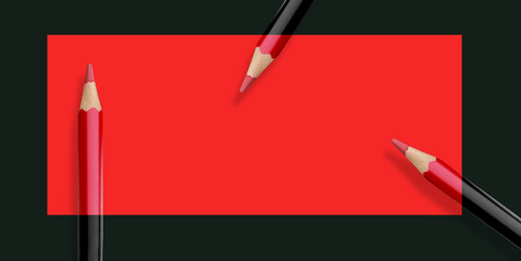 Black pencils in the red frame and red partially Crayons in rectangle.