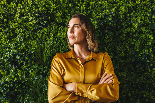 Green office goals: A successful businesswoman contemplates eco-friendly strategies