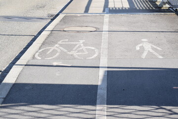 bike and pedestrian lane signs on a border bridge
