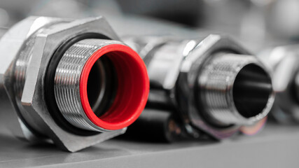 Rubber hoses and tubes close-up with metal fasteners, industrial concept background