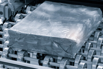 Automatic industrial machine for plastic packaging with light effect of products and food....