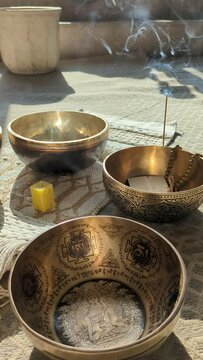 beautiful golden Tibetan singing bowls on the floor