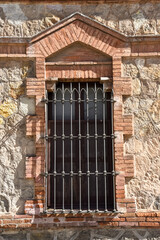 Fototapeta na wymiar old Street windows by the streets of Barcelona with metal bars