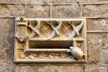 Gordijnen old mailbox facade made or marble with birds and a turtle in the gothic area of Barcelona, catalonia, spain © S J Lievano
