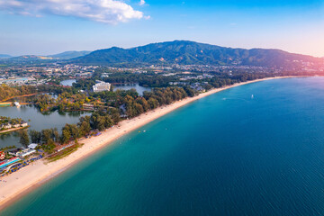 Aerial top view panorama sunset Bang Tao beach with sea of Phuket paradise. Concept tropical travel...