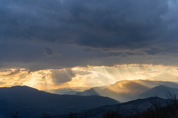 Albania, sunset between the clouds on the mountain with an amazing view