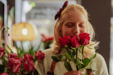 Woman smelling roses joyfully