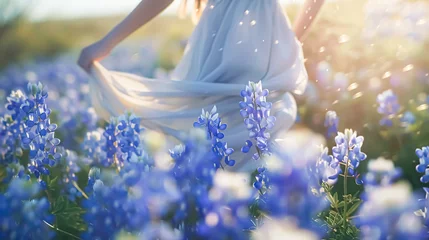 Wandcirkels plexiglas Beautiful bride in a field of bluebonnets at sunset. blue lupine flowers. lavender flowers. © korkut82