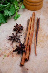 Cinnamon sticks and Star anise on a wooden board. They are spices that have a hot taste with home-cooked and herb ingredients. Close-up cinnamon sticks and star anise. Spices and herbs idea image.