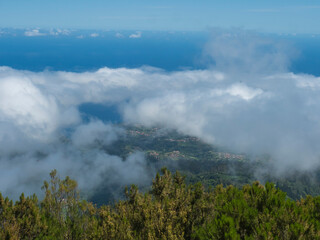 View over the mountains and Atlantic Ocean above the clouds at hiking trail PR1.2 from Achada do Teixeira to Pico Ruivo, the highest peak in the Madeira, Portugal - 766492246