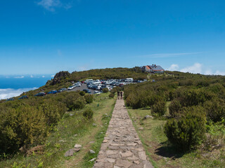 Full parking lot, car park of the Achada do Teixeira, an altitude restaurant at the start of the hiking trail PR1.2 from to Pico Ruivo mountain, the highest peak in the Madeira, Portugal - 766492699