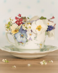 Coffee cup with filled with spring flowers