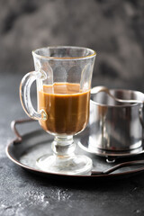 Milk coffee in an Irish glass and phin - 766496802