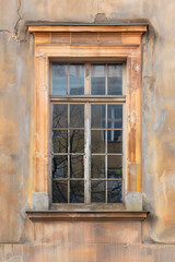 Fototapeta na wymiar Window in the wall of an old house