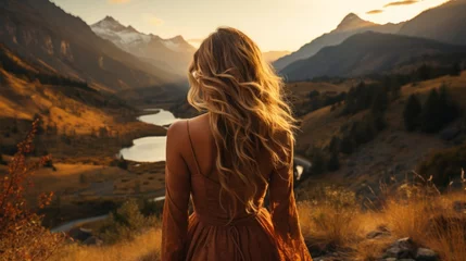 Kussenhoes Blonde woman standing on a hill admiring the mountain and river view © Molostock
