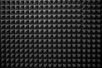 Close-Up View of Black Acoustic Foam Panels in a Soundproof Recording Studio