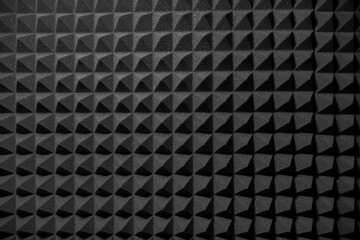 Close-Up View of Black Acoustic Foam Panels in a Soundproof Recording Studio