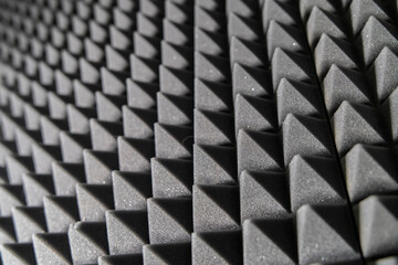 Close-Up View of Black Acoustic Foam Panels in a Soundproof Recording Studio