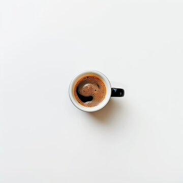 a top view of a cup of coffee on a white background