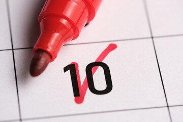 10th day in the calendar is marked with a red marker. - obrazy, fototapety, plakaty