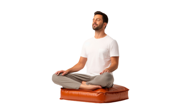 A man achieves inner peace, sitting on a soft pillow in a lotus position