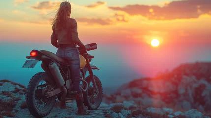 Foto op Plexiglas biker girl and classic motorcycle at sunset © Cristina