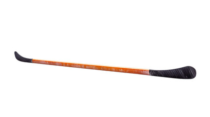 A hockey stick with a vibrant orange tip stands out against a dark background - obrazy, fototapety, plakaty