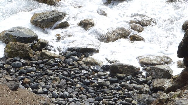 Pebbles formed by incessant waves. High quality photo