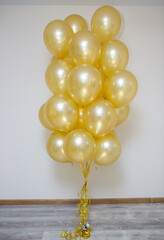 golden mother of pearl balloons in a bunch
