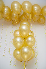 golden mother of pearl balloons in a bunch