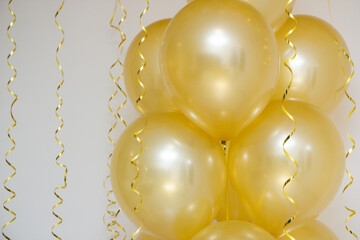 mother of pearl gold balloons with gold ribbons