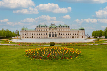 Belvedere Palace Austria, landmark attraction with ornate facade, fountains, statues and reflection pool - 766516493