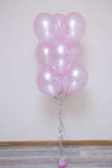pearlescent pink balloons on white background