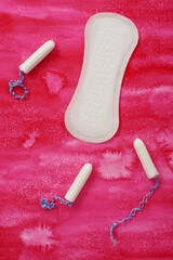 Hygienic pad and tampons on a pink background © IntelWond