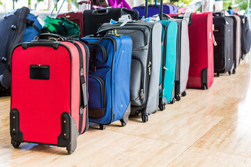 Row of travel bags in a tropical resort reception. Tourism, vacation and travel concept.