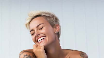 A woman with a tattoo on her arm is smiling