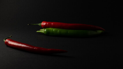 hot chili peppers on black background