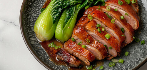 Jinan roasted duck, its crispy, reddish-brown skin beside vibrant green bok choy, on a charcoal gray plate, isolated on white background - obrazy, fototapety, plakaty