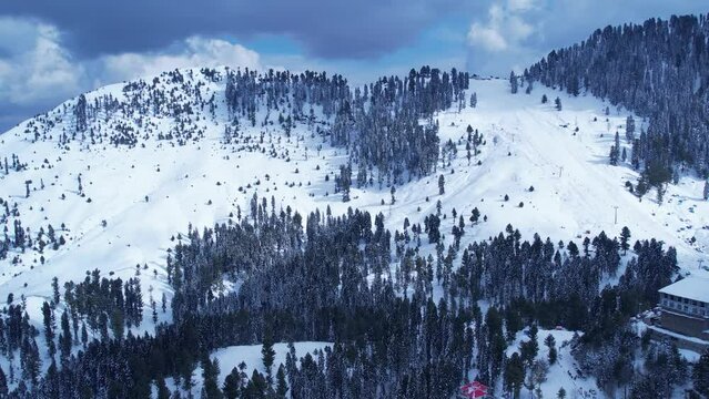 Drone footage of snow covered Malam Jabba Ski resort in Himalayan Mountains during winter in Swat Khyber Pakhtunkhwa Pakistan