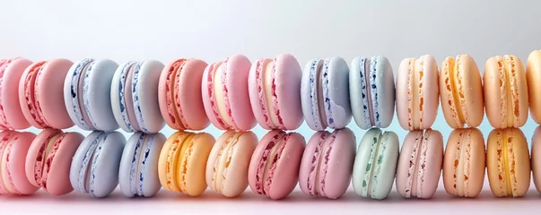 Fototapeten Colorful macarons in a row on gradient background © bluebeat76