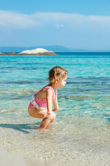 happy child playing by the sea