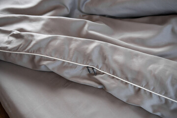 close up of gray satin bed linen background