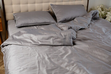 gray cotton satin bed linen on the bed - 766569258