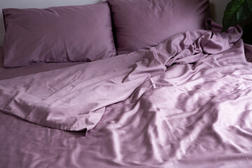 set of crumpled bed linen on the bed in the bedroom daylight - 766574406