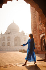 Beautiful woman with blue dress, in the morning at Taj Mahal, India