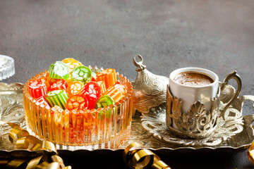A sixteenth-century flavor Traditional Turkish Hard Colorful Candy is Akide in glass bowl with Turkish Coffee	